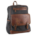 Backpack with black body and brown leather accents on a white background