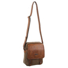 Brown leather crossbody bag on a white background